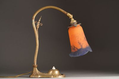 a lamp that is sitting on a table next to a wall