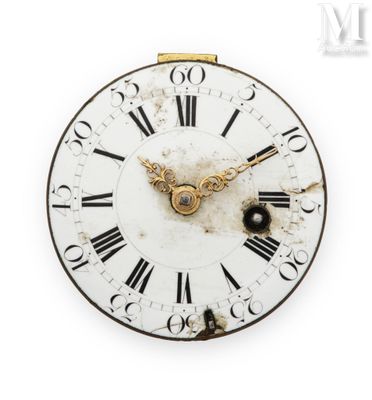 une horloge avec des chiffres romains sur le cadran