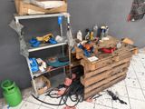 a workbench with tools on top of it in a room