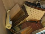 a pile of old furniture in the corner of a room