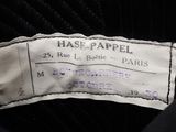 the label of a black jacket with a white label on it