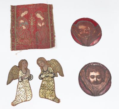several pieces of art are displayed on a white surface