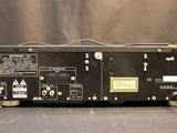 a close up of a black amplifier sitting on top of a table