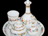 a picture of a set of porcelain objects on a plate