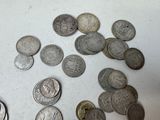 a lot of coins that are on the table