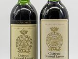 deux bouteilles de vin posées l'une à côté de l'autre sur une table