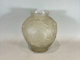 a glass vase that is sitting on a table