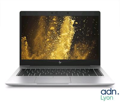 a laptop computer with a gold background on the screen