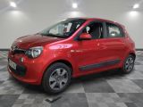 the small red car is parked in the garage on a checkered floor