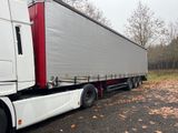 a semi truck that is parked on the side of the road