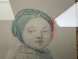 a drawing of a child with a green hat on