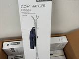 a cardboard box with a coat hanger on top of it