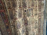 a large oriental rug on display in a room