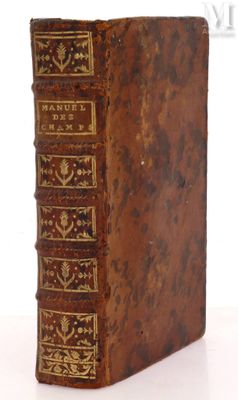 an old book sitting on top of a table next to a white background