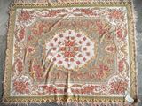 an old rug with a floral design on it
