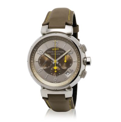 a close up of a watch on a white surface with a white background