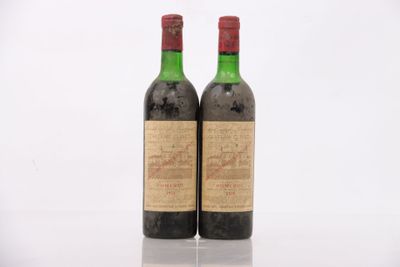 two bottles of wine sitting next to each other on a table