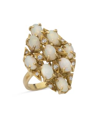 a white oplite and diamond cluster ring