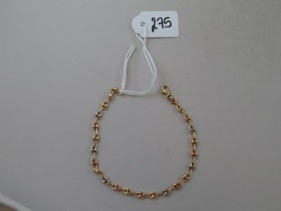 a close up of a bracelet on a white surface with a price tag
