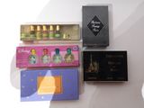 a box of perfume and a box of perfume next to each other