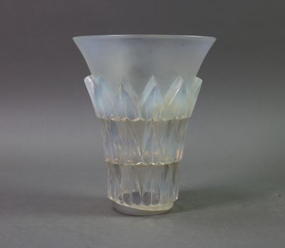 a glass vase that is sitting on a table