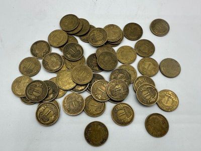 a lot of coins that are on the table