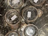 six glasses of water sitting on top of a marble table