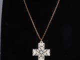 a necklace with a cross on a mannequin mannequin mannequin mannequin mannequin mannequin mannequin mannequin mann