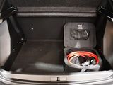a trunk of a car with a pair of shoes in it