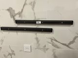 two speakers that are on the wall in the bathroom