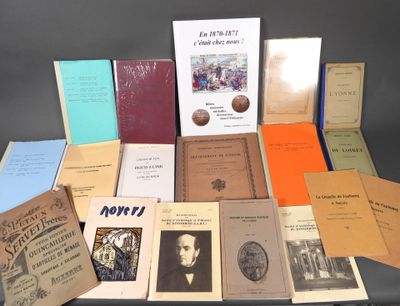 several books are stacked on top of each other on a table
