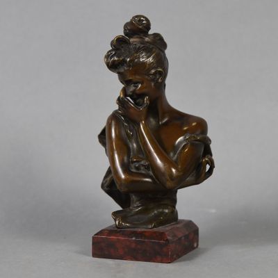 bronze statue of a woman holding her hand to her chin