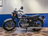 a motorcycle that is sitting on a wooden floor