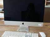 a computer on a table with a keyboard and mouse