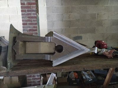a metal object on a wooden table in a room