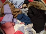 a suitcase full of clothes that is sitting on the floor