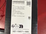 the back of a box with a sticker on it sitting on a table