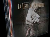 the dvd covers of the movie la luste de schindler are stacked on top of each other