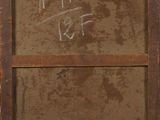 an old wooden frame with writing on it and a yellow marker in the middle