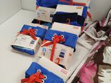 a lot of blue and red items on a bed