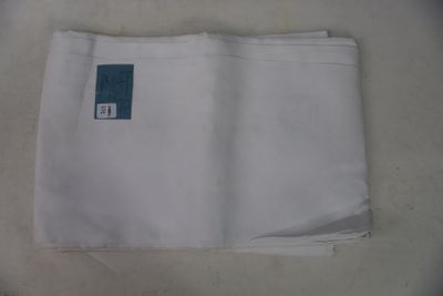a piece of white cloth with a blue tag on it