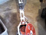a machine that is sitting on the floor in the garage