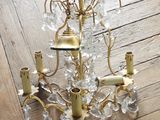 a chandelier that is sitting on a wooden floor