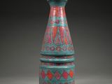an image of a blue and red vase sitting on top of a table