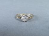 a close up of a diamond ring on a table