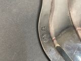 a close up of a spoon and a fork on a table