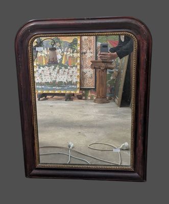 a man taking a picture of himself in a mirror