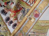 a close up of a scarf with a picture of a horse and people on it