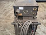 a close up of a welding machine in a garage