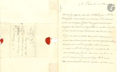an old document with a piece of paper on top of it and a piece of paper on the bottom of it